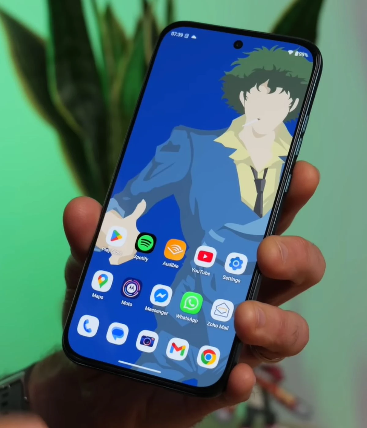 Motorola G77 smartphone displaying animated character wallpaper and app icons
