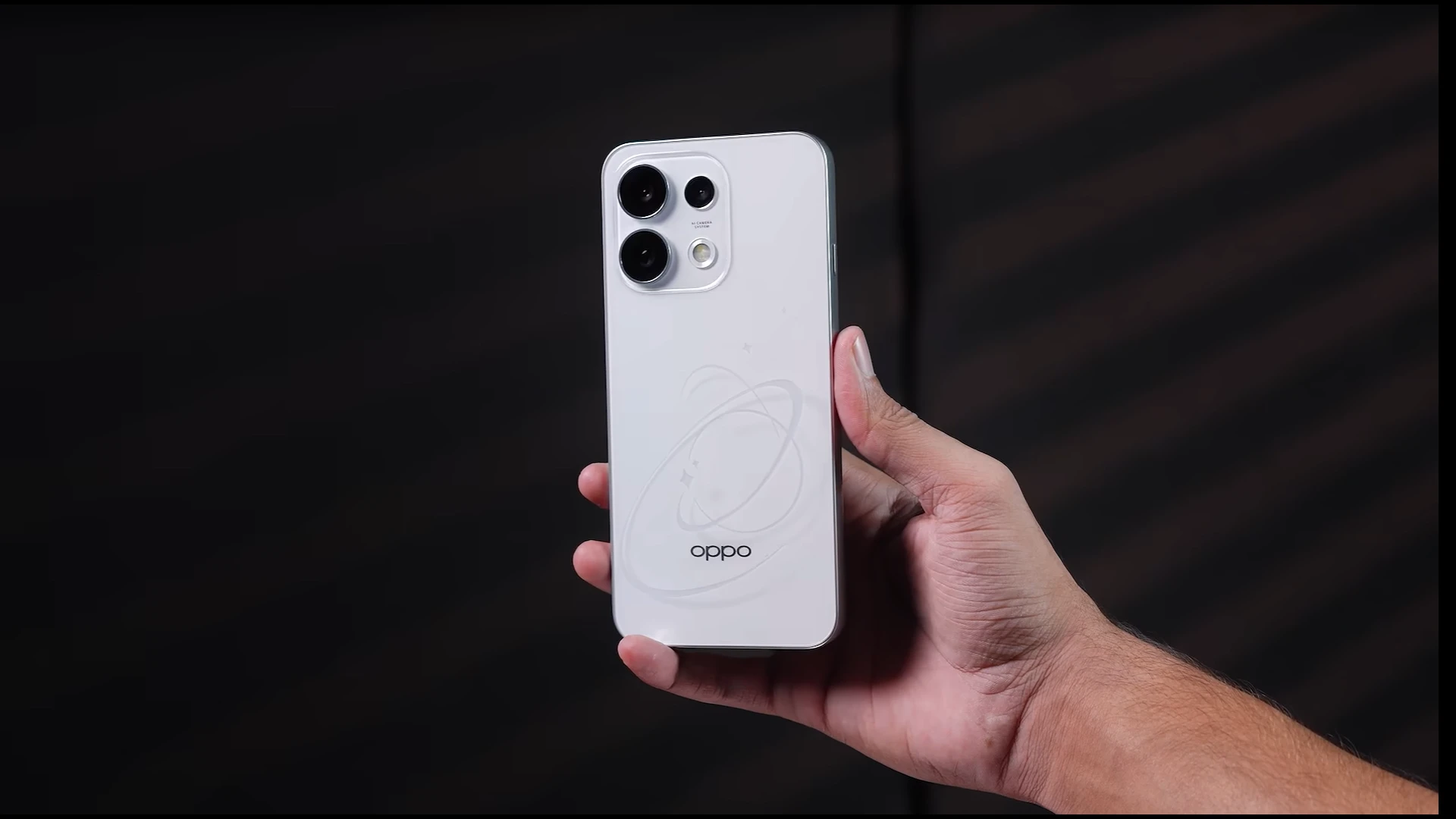 Oppo Reno 16F smartphone held in hand, showcasing its sleek white design and dual-camera setup.