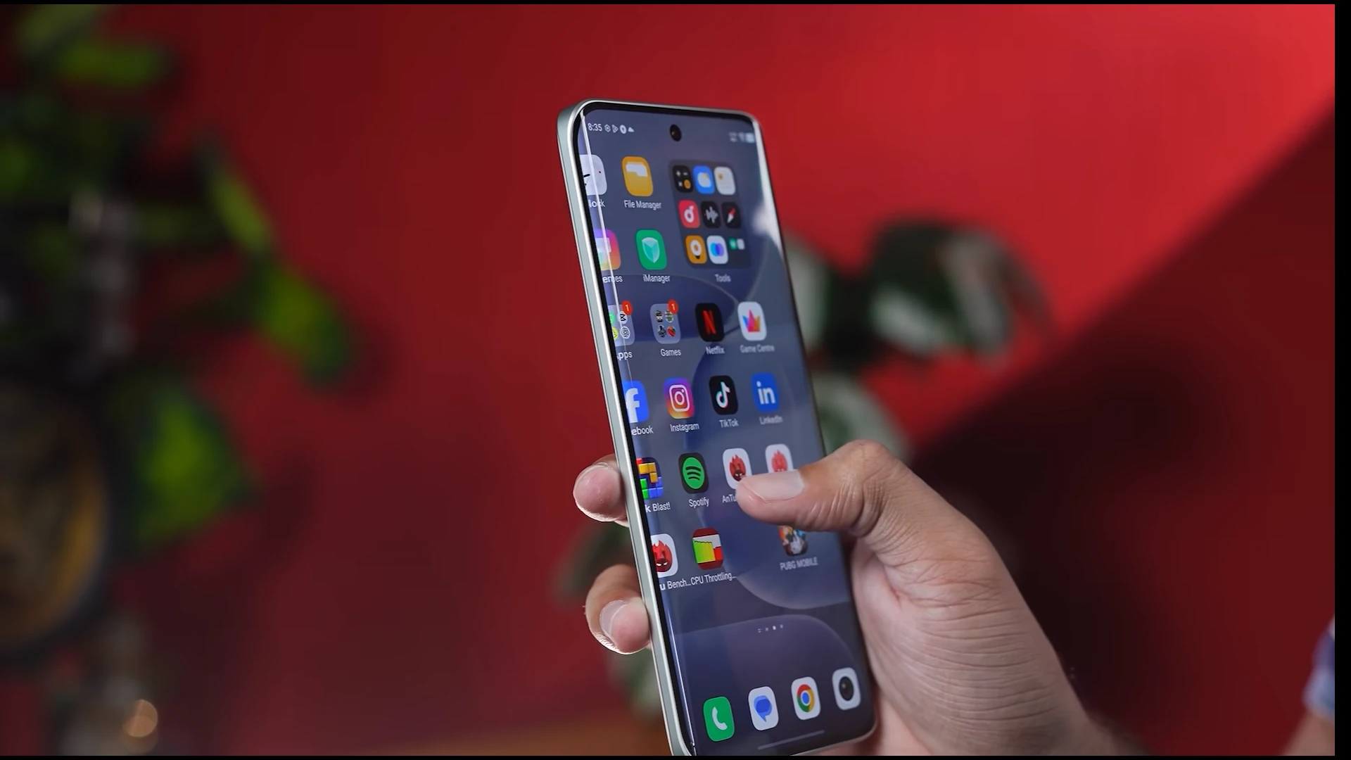Person holding Vivo V80 Lite smartphone displaying various apps on the screen